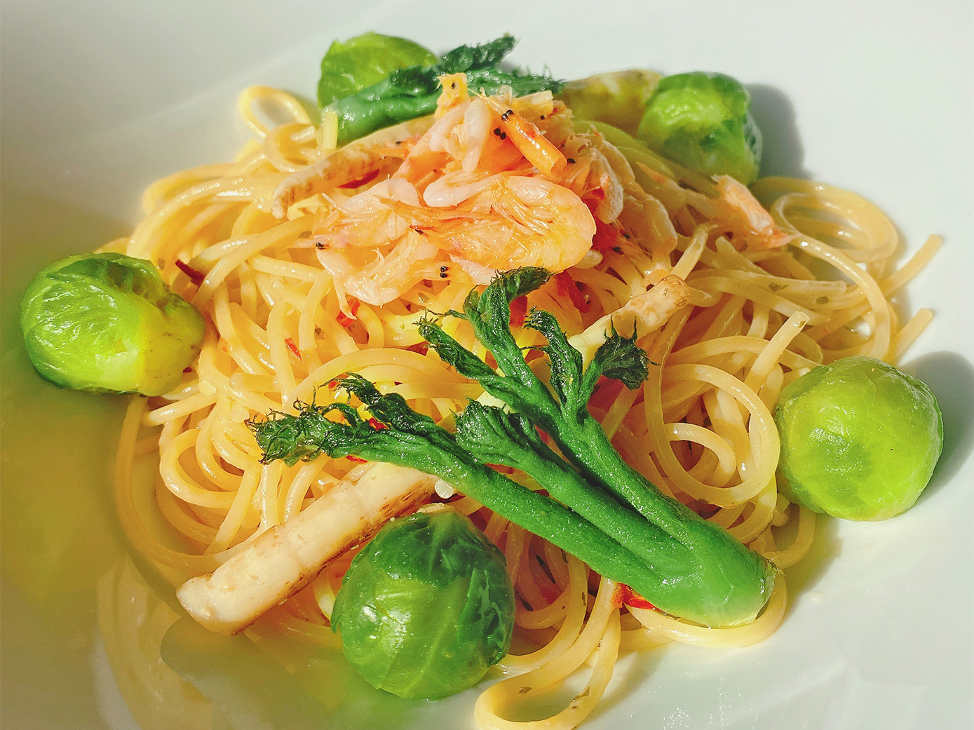 Peperoncino spaghetti with sakura shrimps and Brussels sprouts